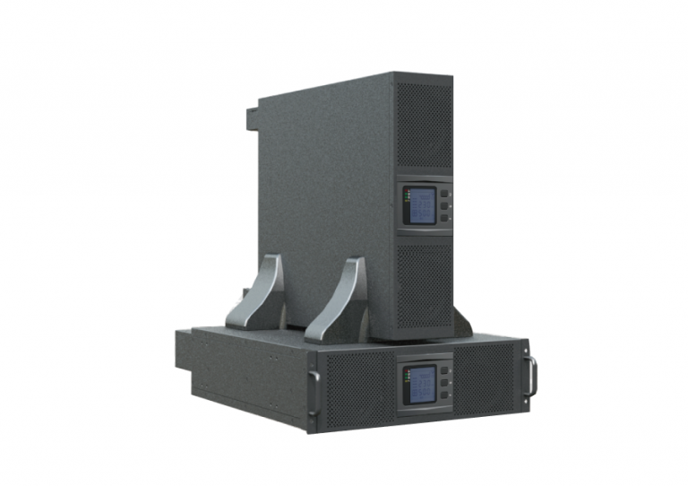 A large, gray industrial machine with textured panels and metallic handles on the side. It has two small control screens with buttons and vents on the front. The machine is mounted on a platform with brackets for support.
